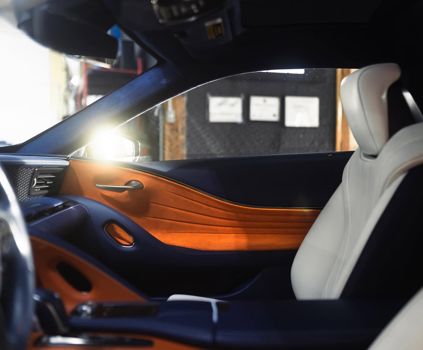Tinted side windows shading the interior of a luxury car